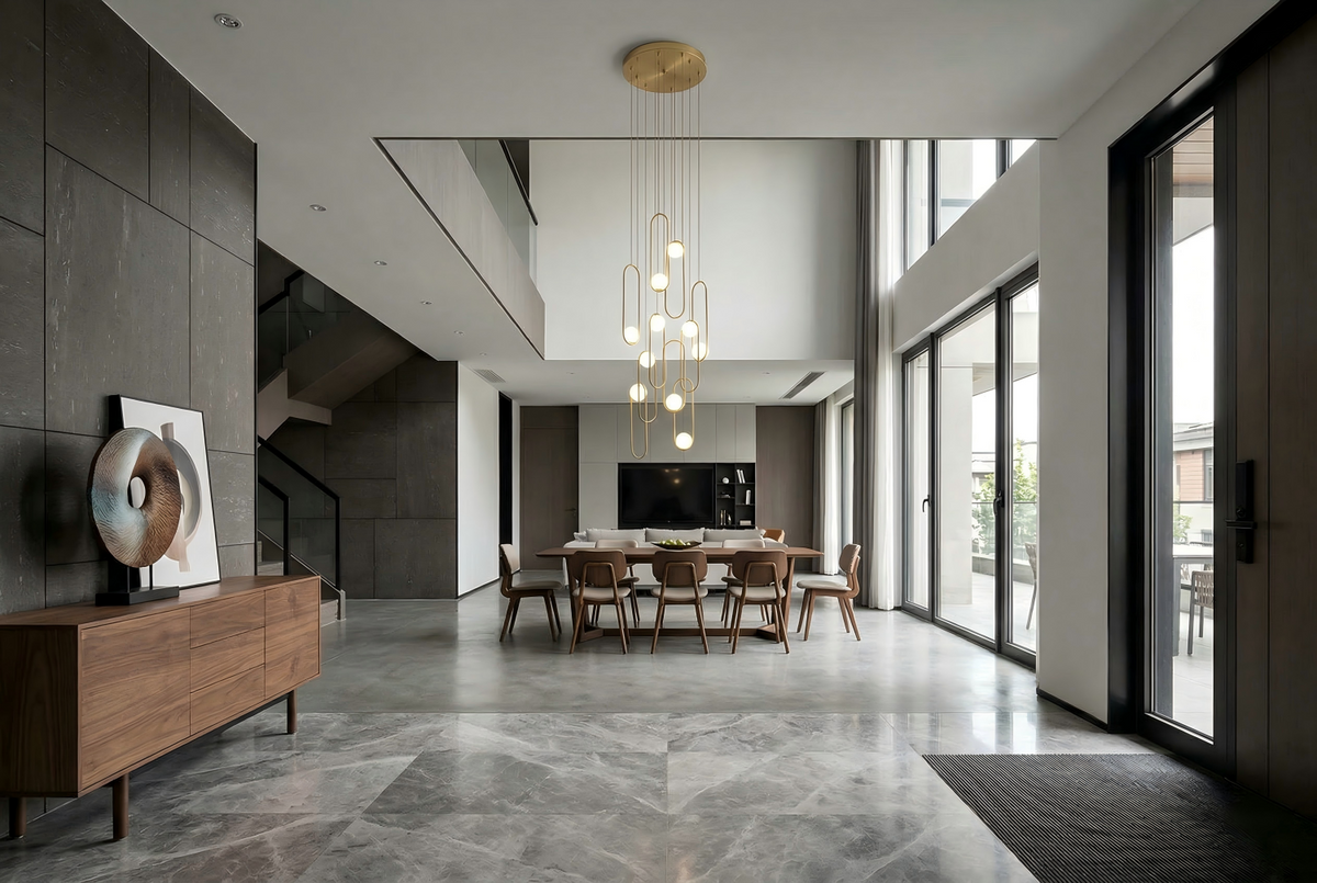 Chandelier installation cost guide showing electrician installing modern pendant light in dining room