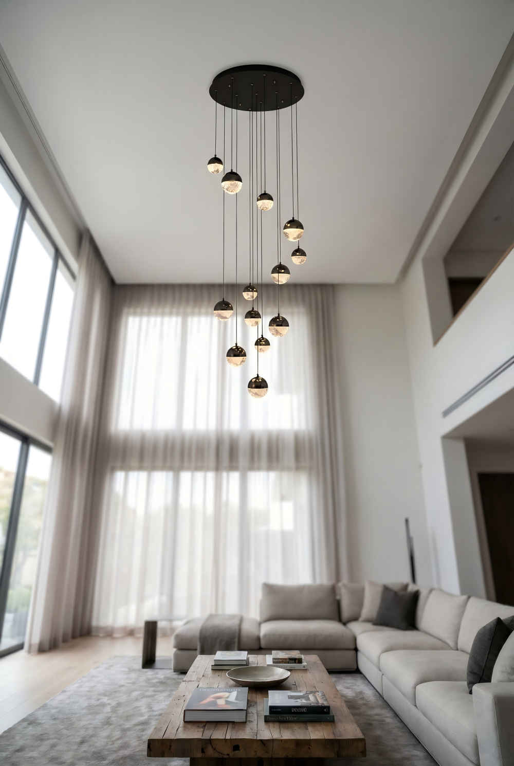 Modern living room with a sectional sofa, coffee table, and pendant lights.