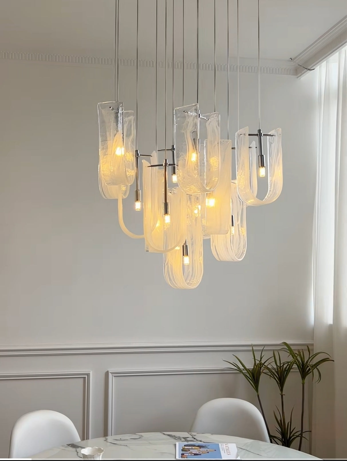 Detailed shot showcasing the premium finish and craftsmanship of the Luminous Waves chandelier.