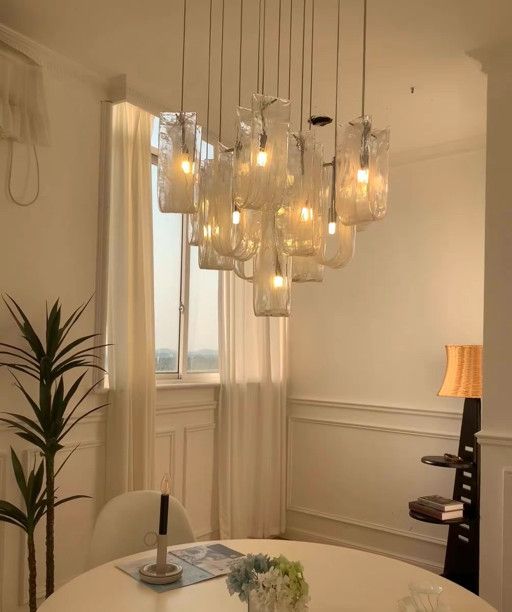 Artistic light patterns and reflections created by the Luminous Waves chandelier.