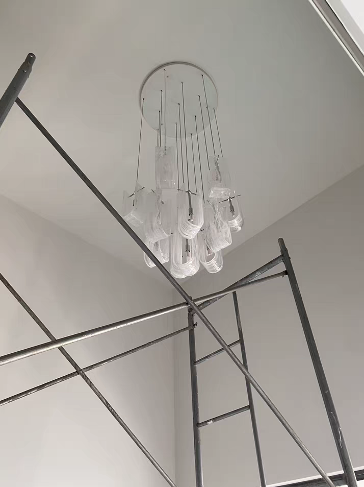 The Luminous Waves chandelier making a sophisticated statement in a spacious room interior.