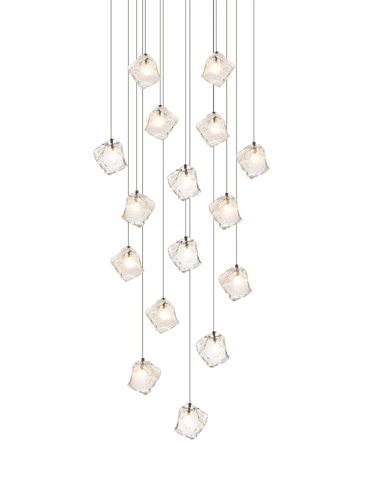 Modern ice cube crystal glass pendant light with internal bubble texture, lit and sparkling