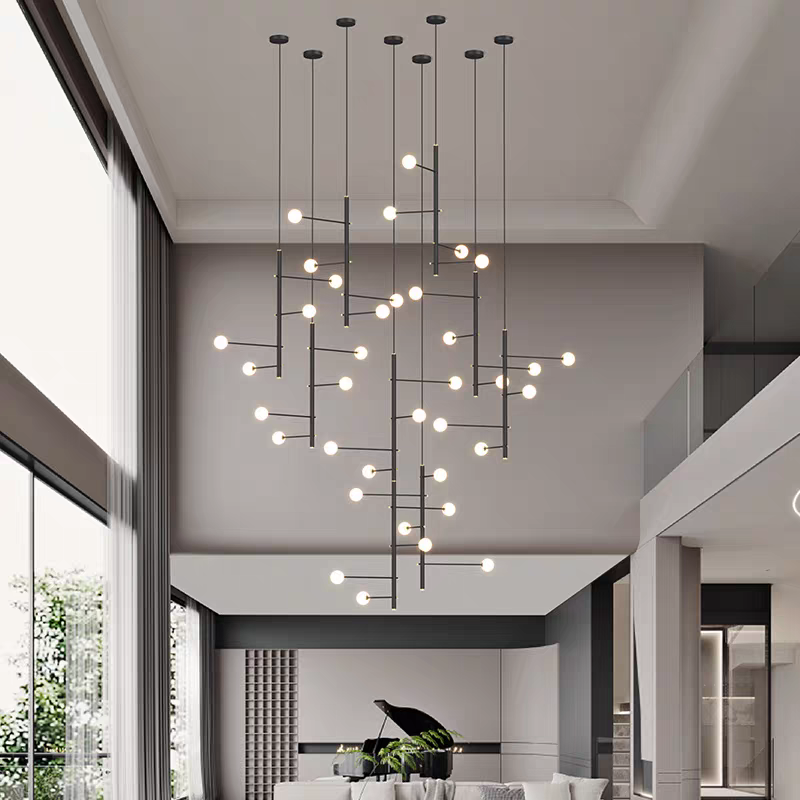 Large black multi-arm opal glass chandelier illuminating a contemporary open-plan living and dining area.