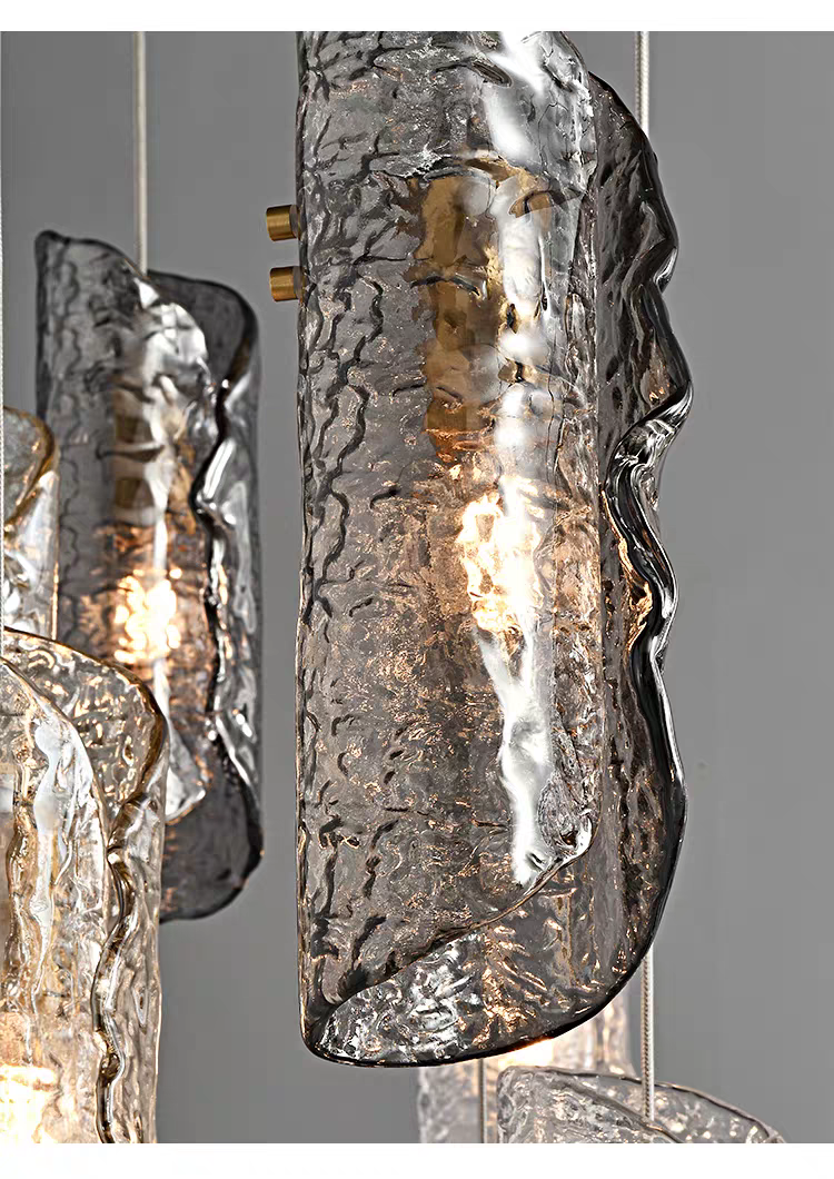 Close-up detail of an individual textured glass pendant from Aurorae Lighting chandelier
