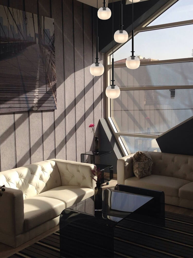 Aurorae’s pendant aglow, casting a warm, creamy light that transforms spaces with chic serenity.