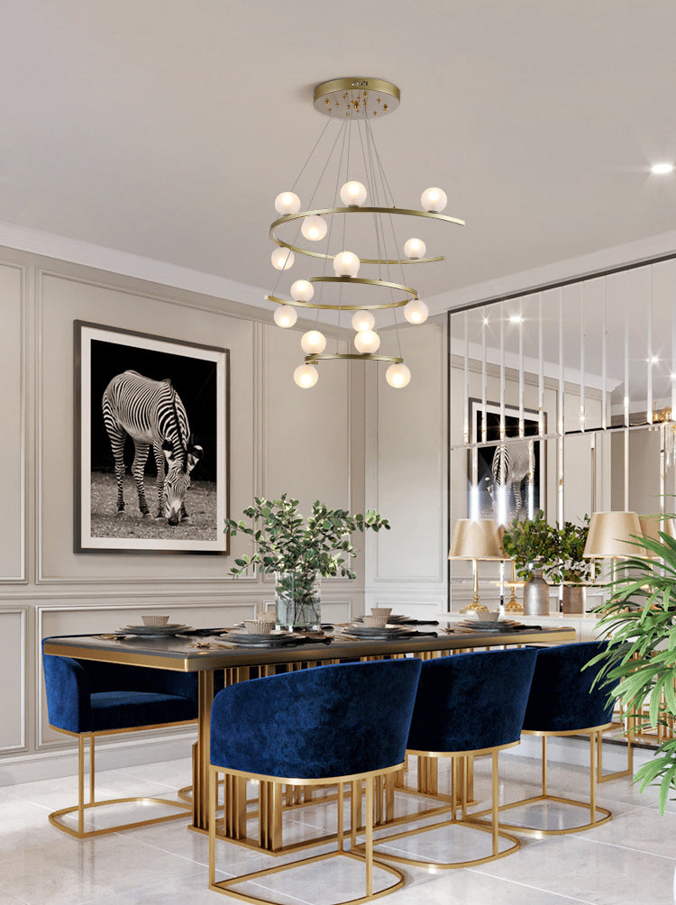 Sleek gold finish on the Aurorae Lighting Half Ring LED chandelier