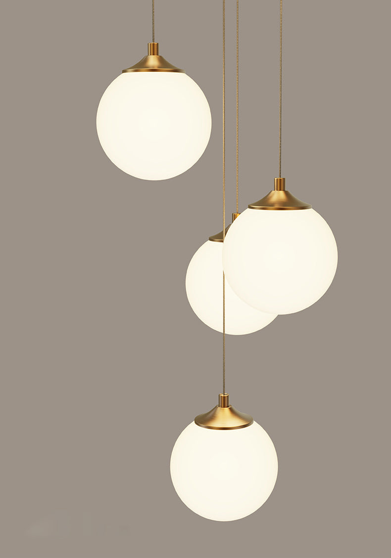 Soft ambient glow from the lit milk white opal glass globe pendant