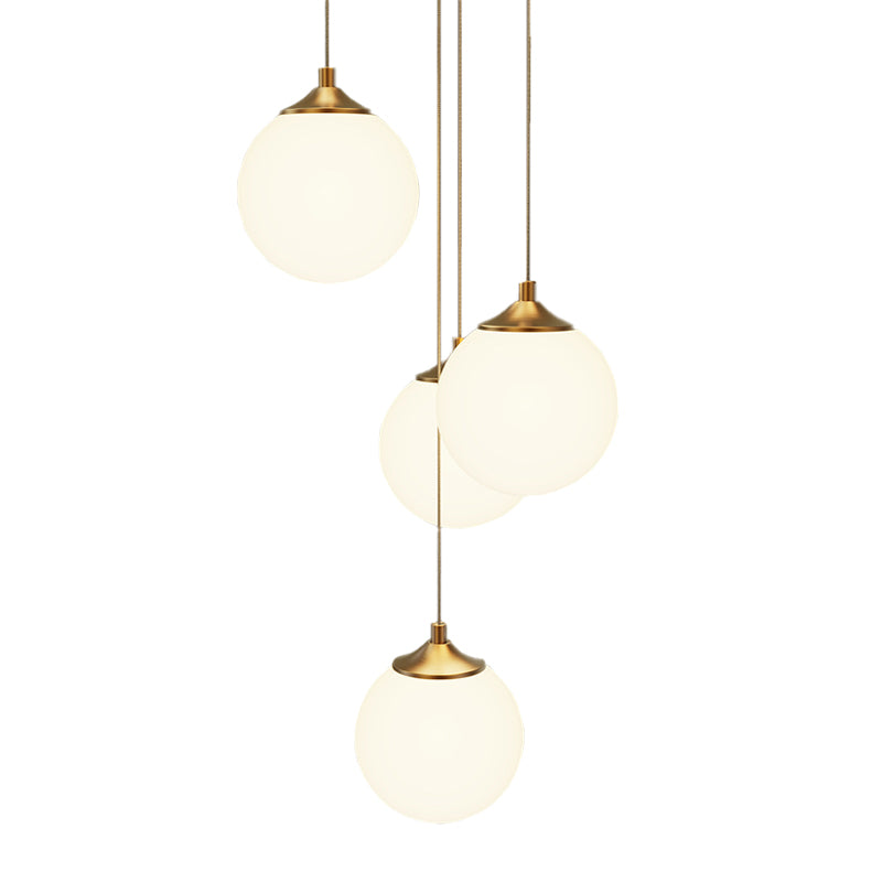 Unlit view of the sleek milk white round pendant light fixture