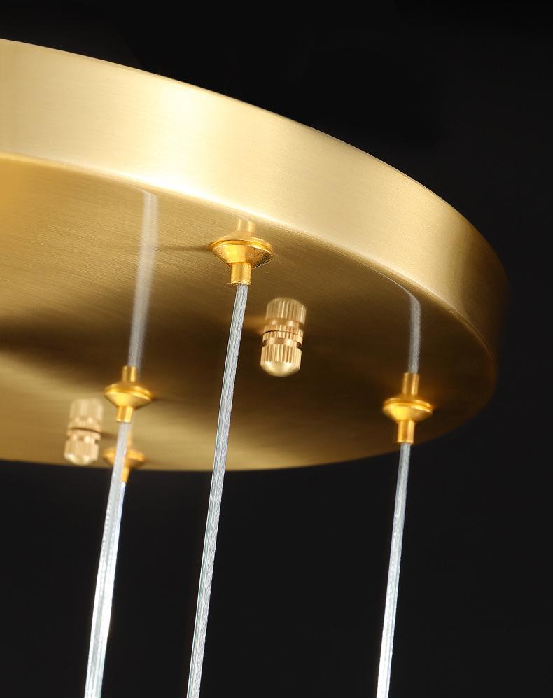 Modern luxury crystal pendant light for bedroom lighting, K9 crystals creating a serene and comfortable sleeping ambiance.