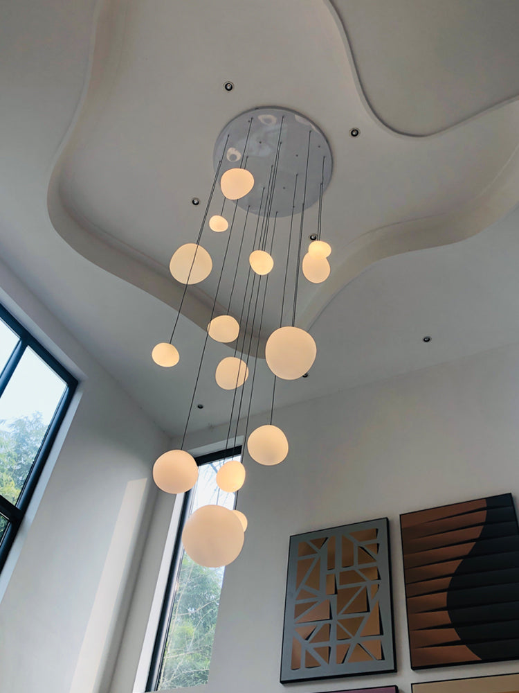 Natural light enhancing the beauty of Aurorae Lighting's glass Pebbles pendants